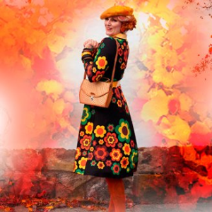 Woman in a colorful midi dress by SHALMIAK. Design: FLORA FOREVER retro.